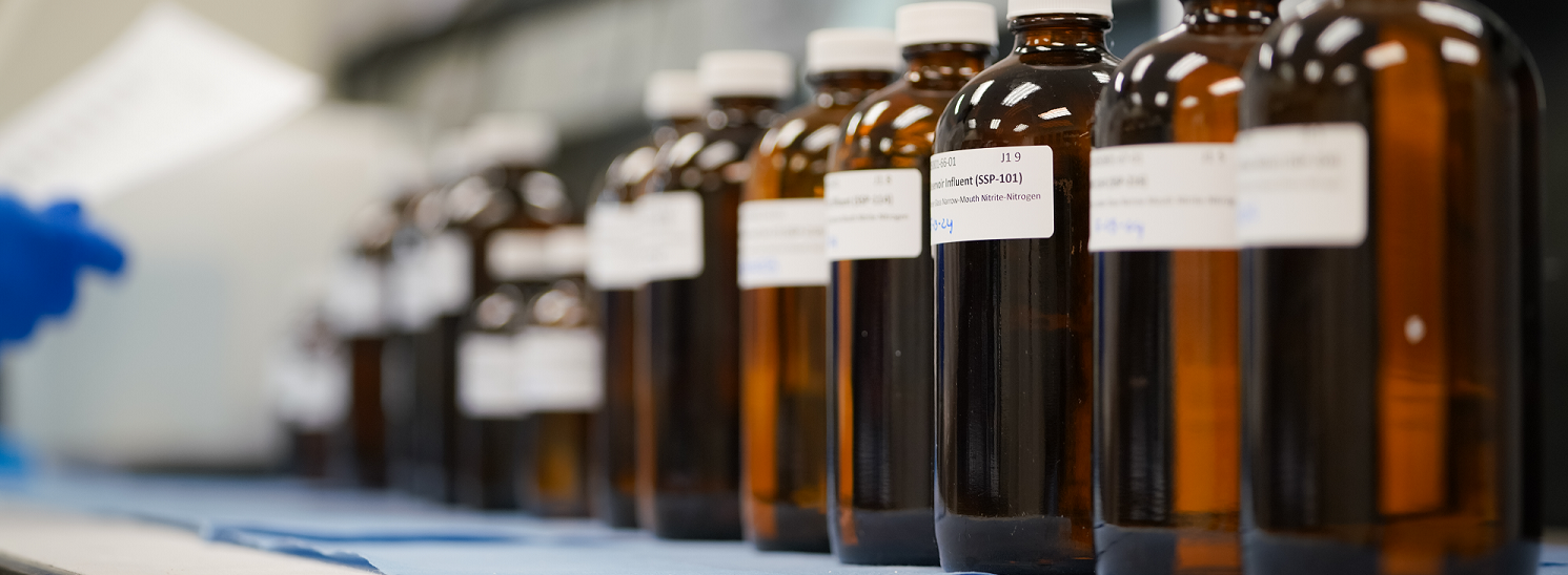 Image of glass amber bottles on a benchtop